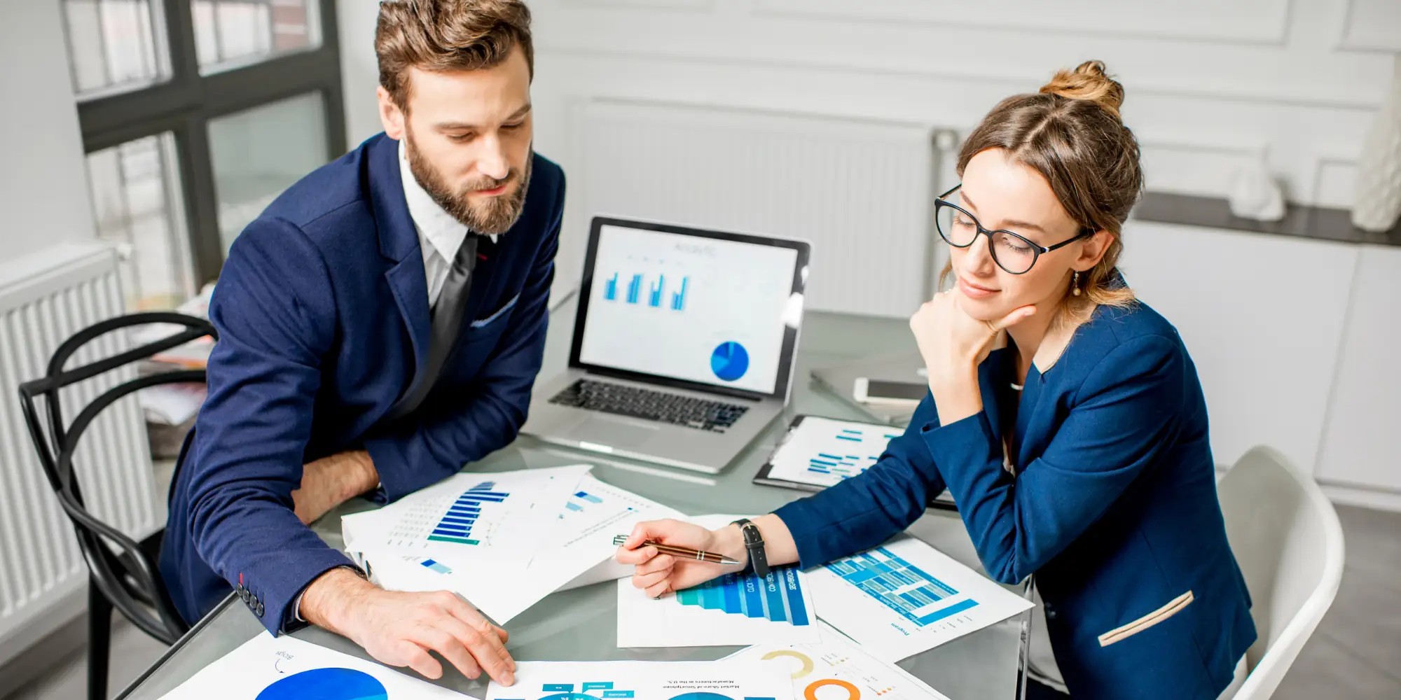 two people in a business meeting discussing marketing techniques